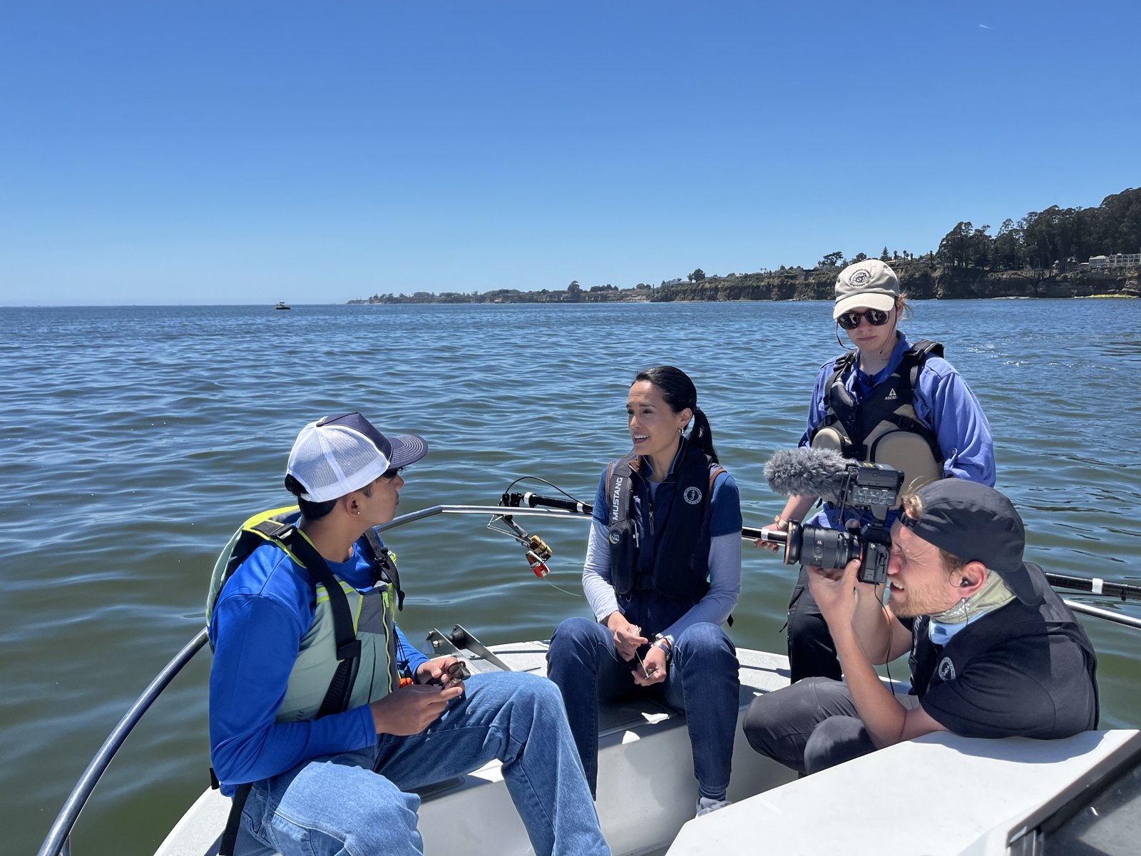 Research and CNN film crew on a boat during shark tagging fieldwork in Monterey Bay